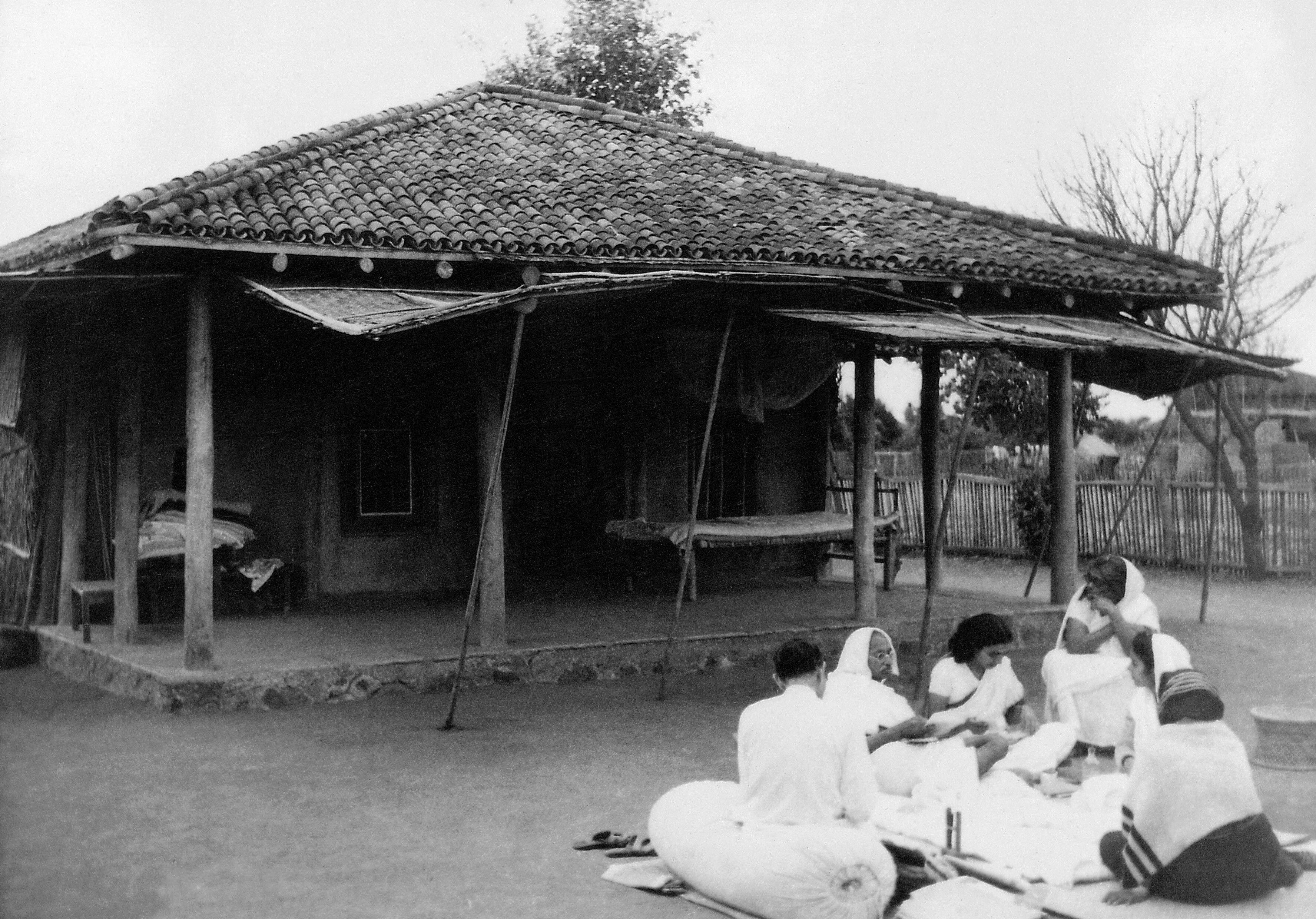 Gandhi seated with coresidents