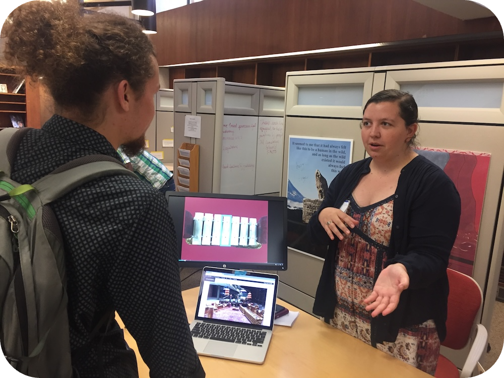 Abby Dolan presents her digital gamelan to another student