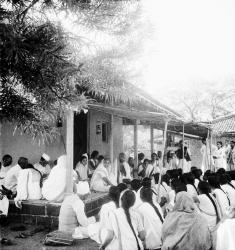 Gandhi and Kasturba speaking to coresidents